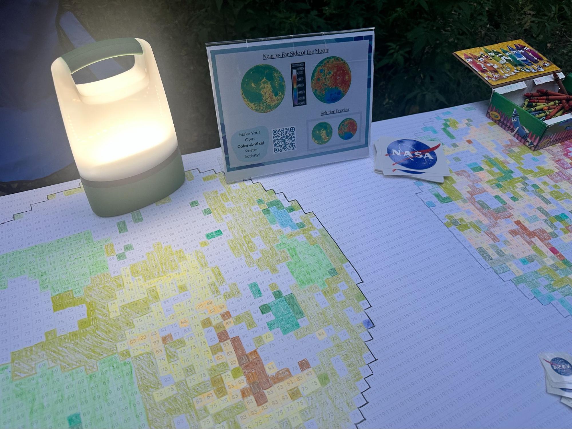 Partially completed Color-a-Pixel poster at an Earth to Sky International Observe the Moon Night outreach event